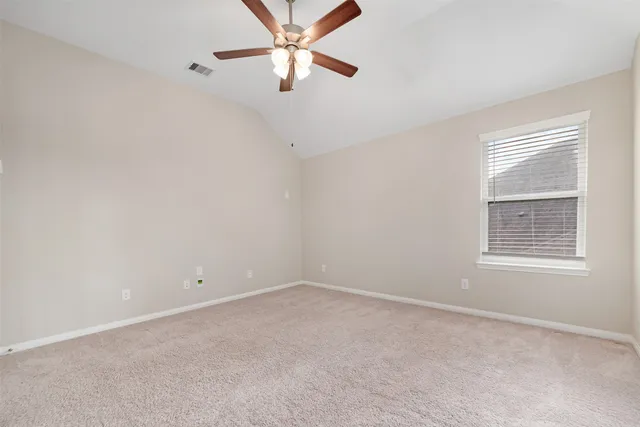 a utility room with cabinets washer and dryer