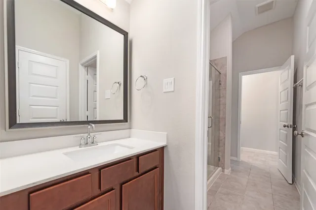 a view of a bathroom with a tub and shower