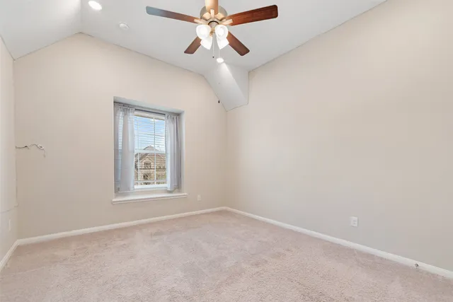 a front view of a house with a garden and yard