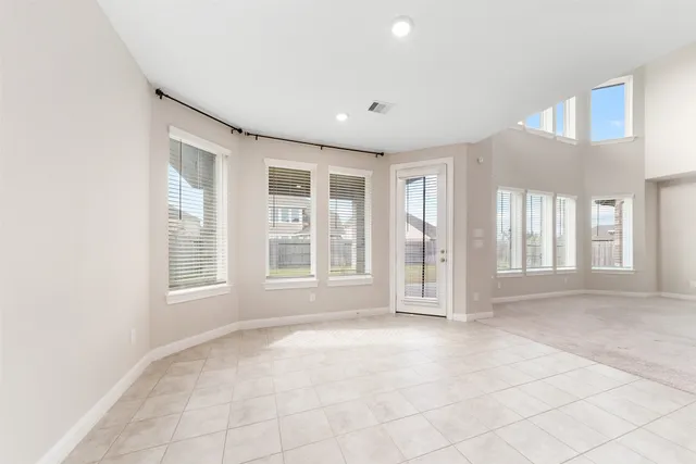 a view of a livingroom with an empty space and a fireplace