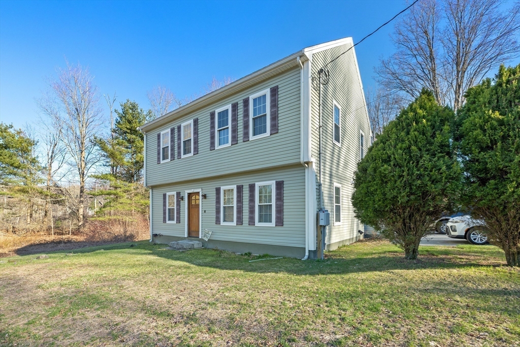 38 Brook Street Georgetown, MA 01833 - Photo 3 of 42 a front view of a house with a yard