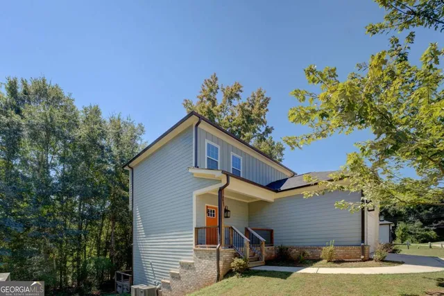 a front view of a house with a yard