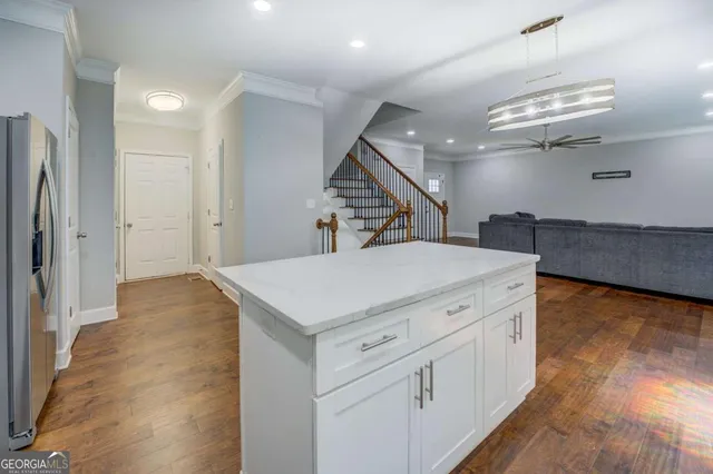 a kitchen with a sink and a refrigerator