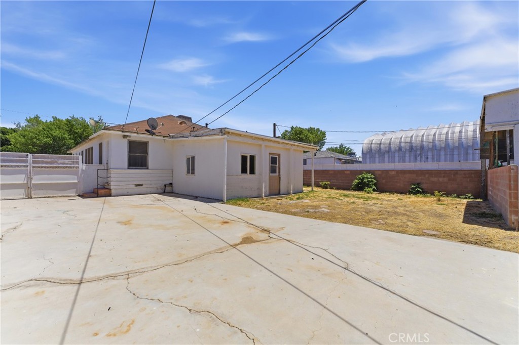 44509 Date Lancaster, CA 93534 - Photo 18 of 20 a front view of a house with a yard