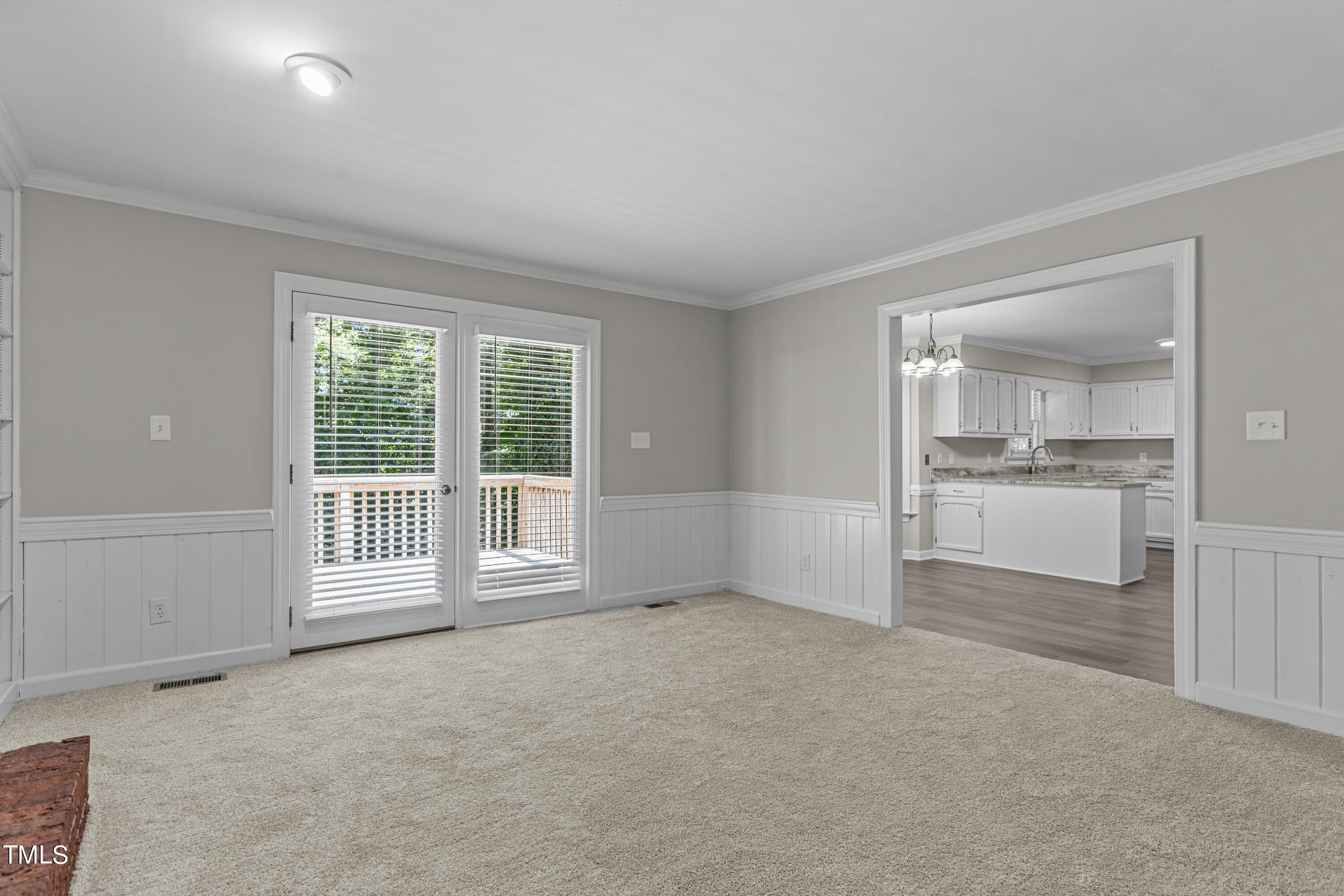 8112 Running Cedar Trail Raleigh, NC 27615 - Photo 19 of 54 Family Room to deck and kitchen view
