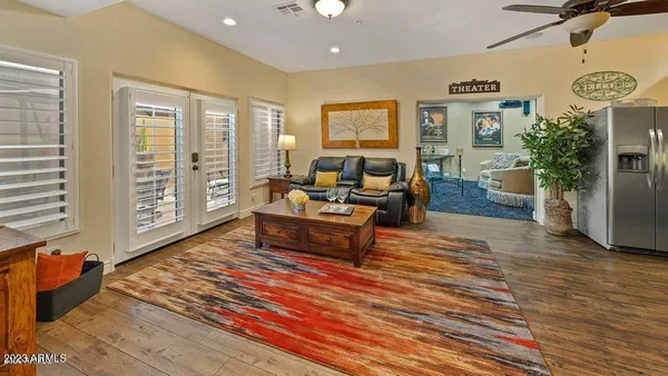 a living room with furniture and wooden floor