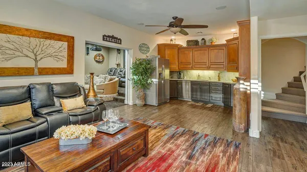 a kitchen with stainless steel appliances granite countertop a refrigerator and a sink