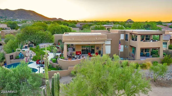 an aerial view of houses with outdoor space