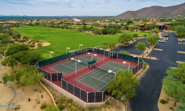 a street sign that is next to a yard