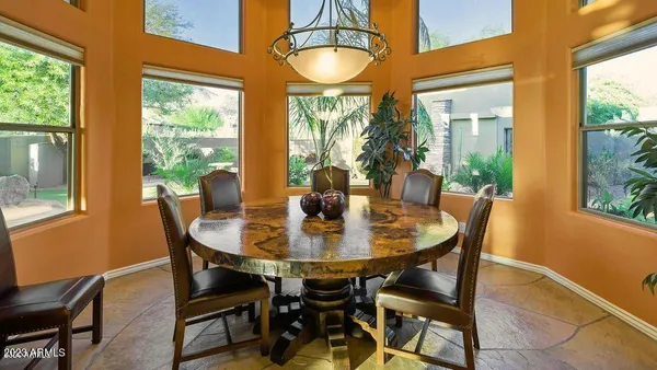 a bedroom with furniture and a mirror