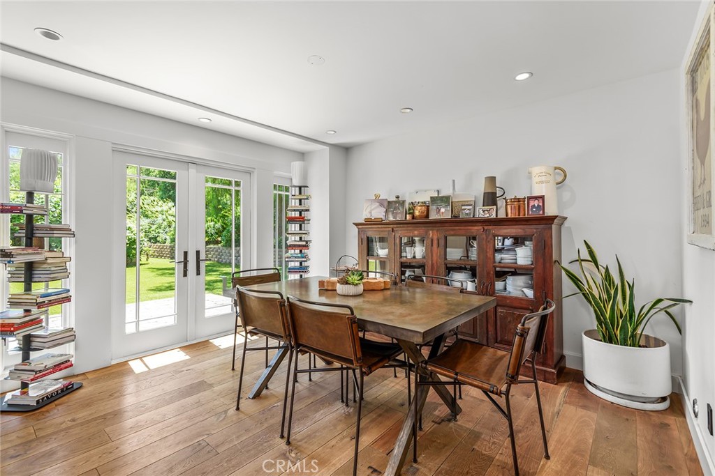 5207 Saddle Creek Road Hidden Hills, CA 91302 - Photo 12 of 54 a view of a dining room with furniture window and wooden floor