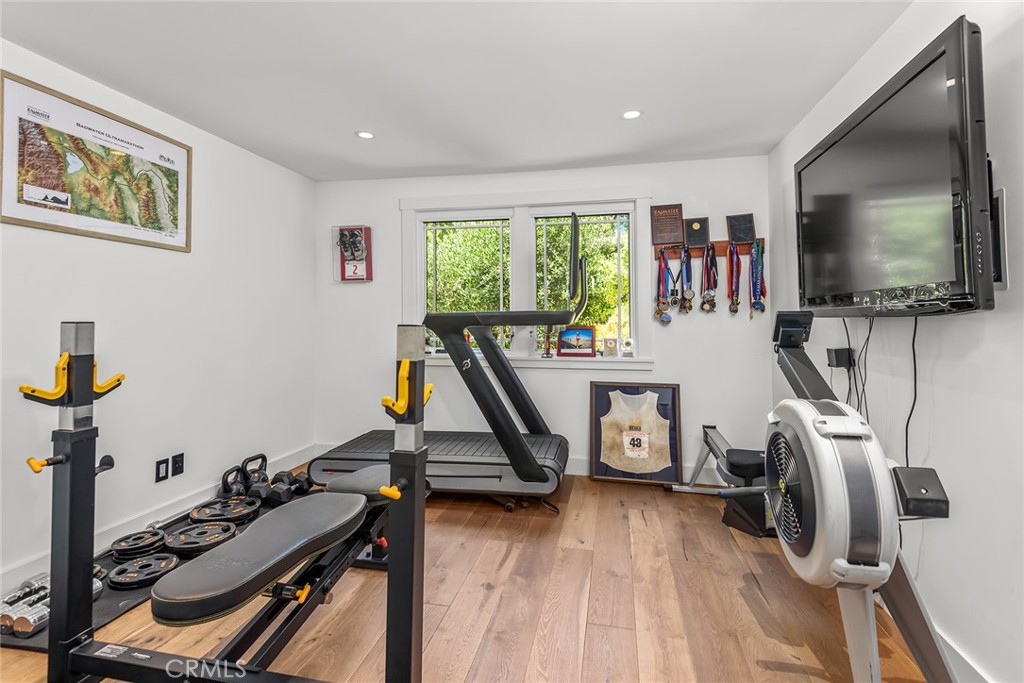 5207 Saddle Creek Road Hidden Hills, CA 91302 - Photo 18 of 54 a view of a room with gym equipment
