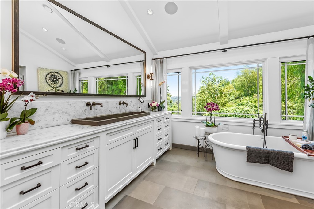 5207 Saddle Creek Road Hidden Hills, CA 91302 - Photo 24 of 54 a large white kitchen with a large window and sink
