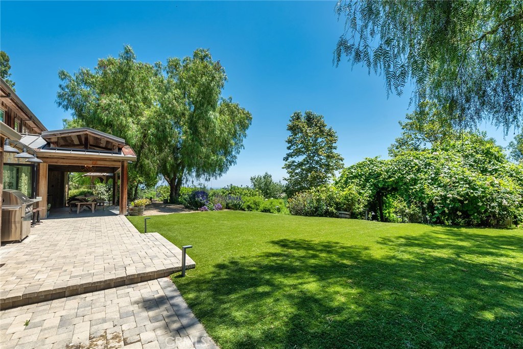 5207 Saddle Creek Road Hidden Hills, CA 91302 - Photo 36 of 54 a view of a house with backyard and sitting area