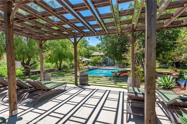a view of a chairs and table in patio