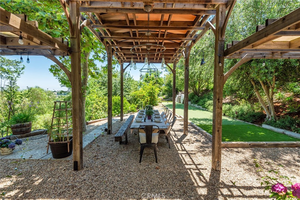 5207 Saddle Creek Road Hidden Hills, CA 91302 - Photo 42 of 54 a view of a chairs and table in patio