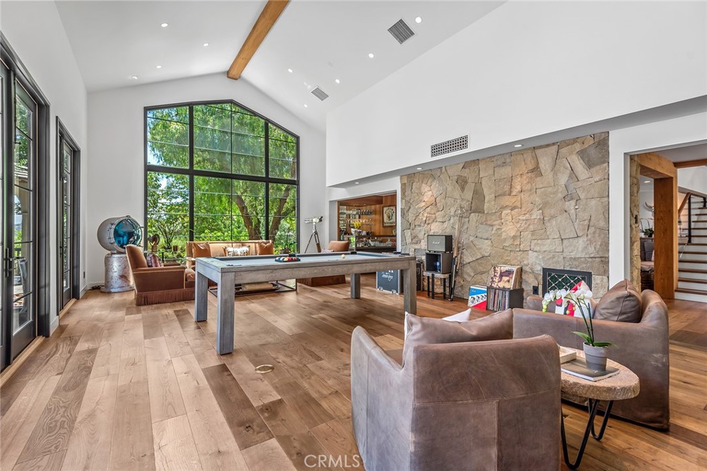 5207 Saddle Creek Road Hidden Hills, CA 91302 - Photo 6 of 54 a living room with furniture and a large window
