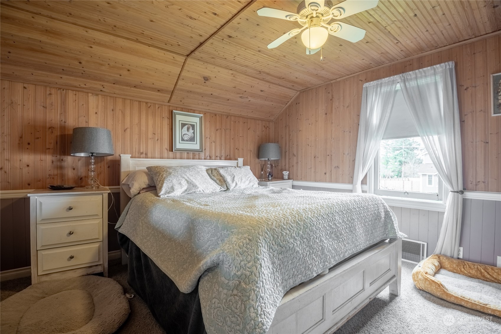 1810 Collins Road Buckley, WA 98321 - Photo 14 of 25 a bedroom with a bed and a chandelier