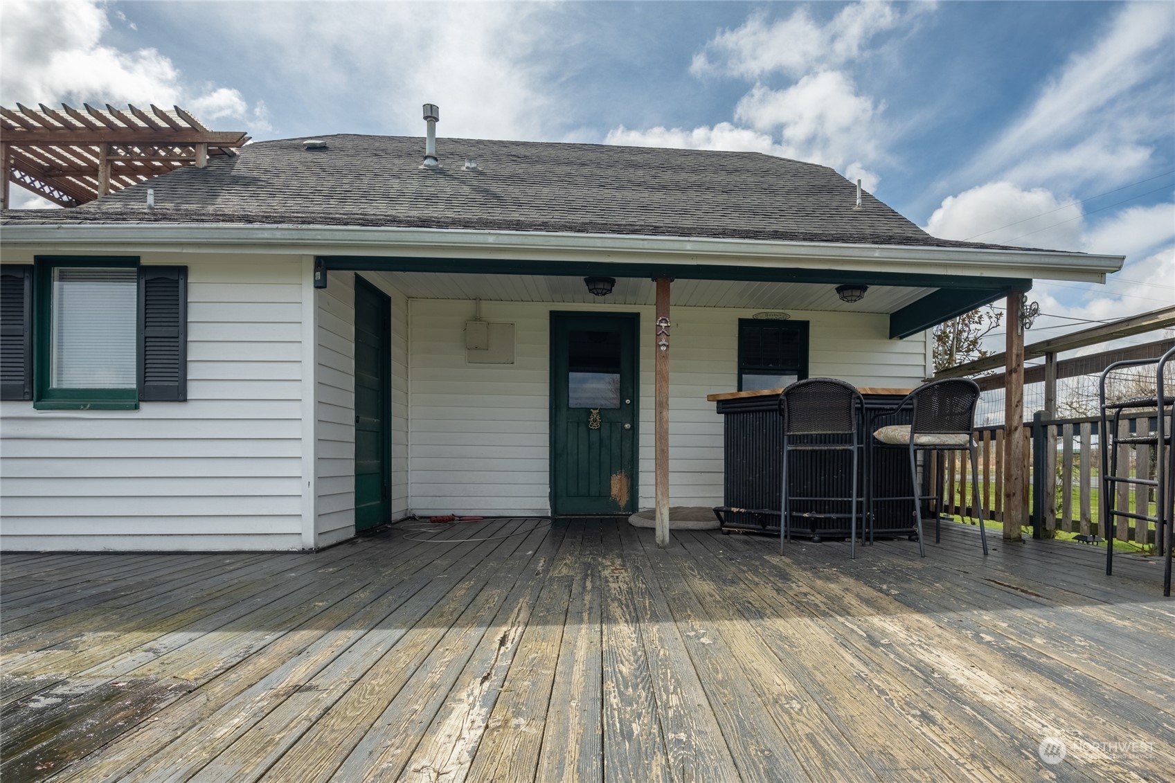 1810 Collins Road Buckley, WA 98321 - Photo 23 of 25 a view of a house with a wooden deck
