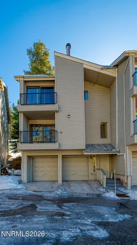a view of a building with a tree
