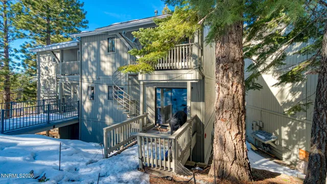 a view of a house with a tree
