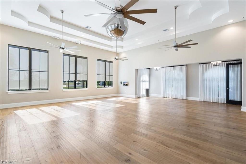 5114 Genoa Street Immokalee, FL 34142 - Photo 26 of 34 Aerobics room with light wood finished floors and a high tray ceiling