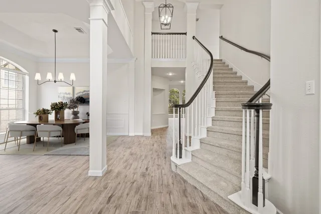 a view of a living room and entryway with wooden floor