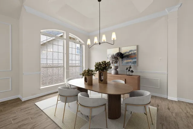 a view of a dining room with furniture window and wooden floor