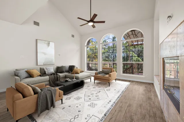 a living room with furniture and a large window