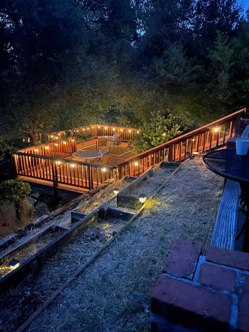 a terrace with outdoor seating and wooden floor