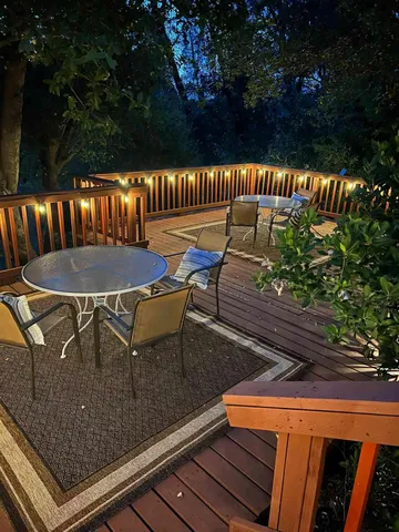 a view of a chairs and table on the deck