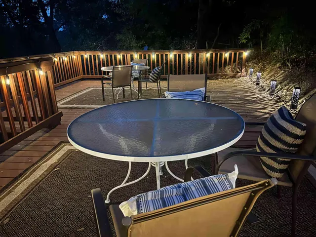 a view of a wooden fence and trees