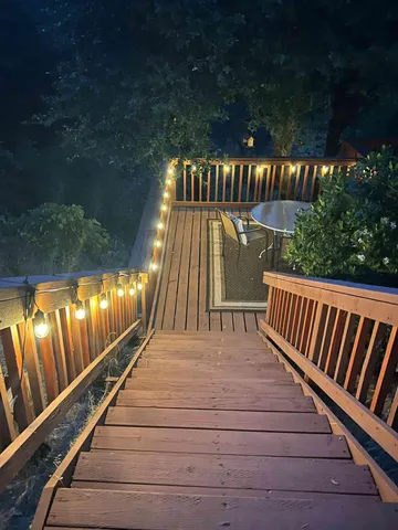 a view of balcony with wooden floor and outdoor space