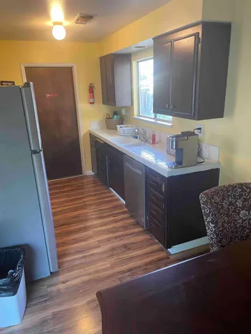 a bathroom with a sink a mirror and a toilet