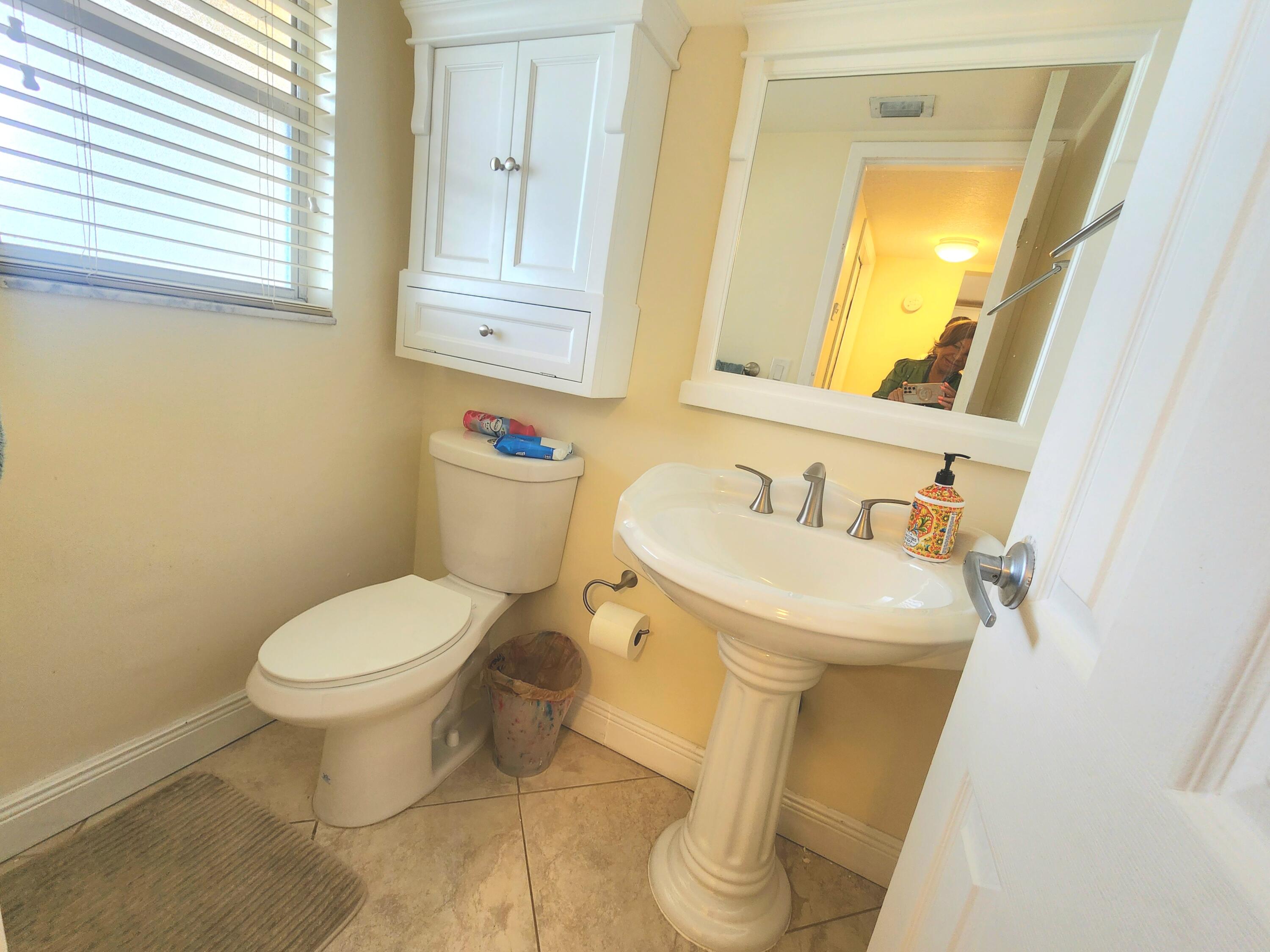 3755 Via Poinciana, Unit 607 Lake Worth, FL 33467 - Photo 13 of 19 a bathroom with a sink and a toilet