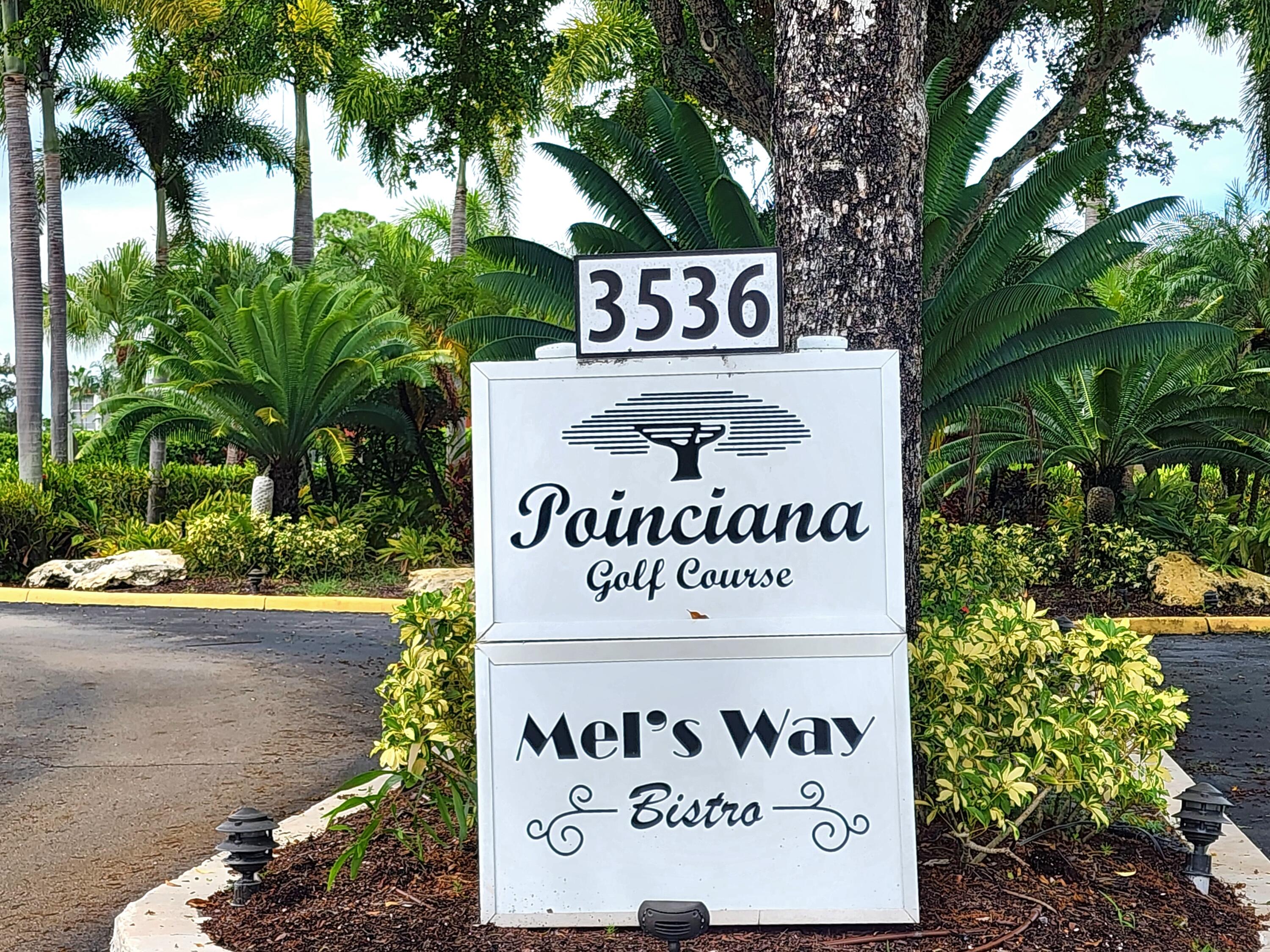 3755 Via Poinciana, Unit 607 Lake Worth, FL 33467 - Photo 18 of 19 a sign on the side of a road