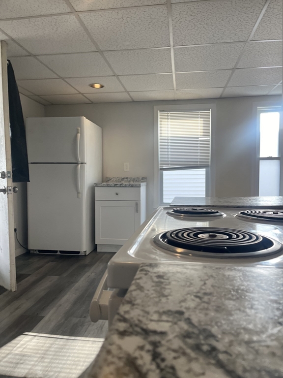 41 Winter Street, Unit 2R Fitchburg, MA 01420 - Photo 3 of 13 a white refrigerator freezer sitting in a kitchen