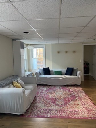 41 Winter Street, Unit 2R Fitchburg, MA 01420 - Photo 4 of 13 a living room with furniture and wooden floor