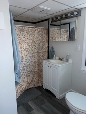 41 Winter Street, Unit 2R Fitchburg, MA 01420 - Photo 5 of 13 a bathroom with a shower toilet and a sink