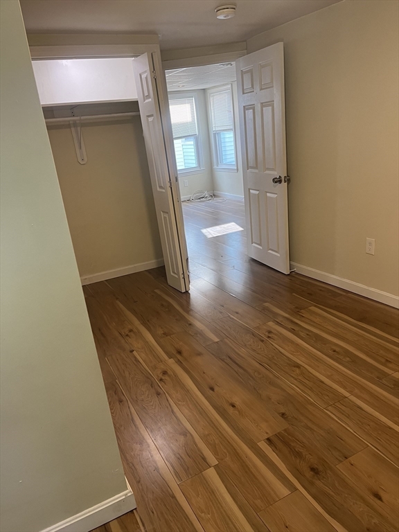 41 Winter Street, Unit 2R Fitchburg, MA 01420 - Photo 10 of 13 a view of a hallway and wooden floor