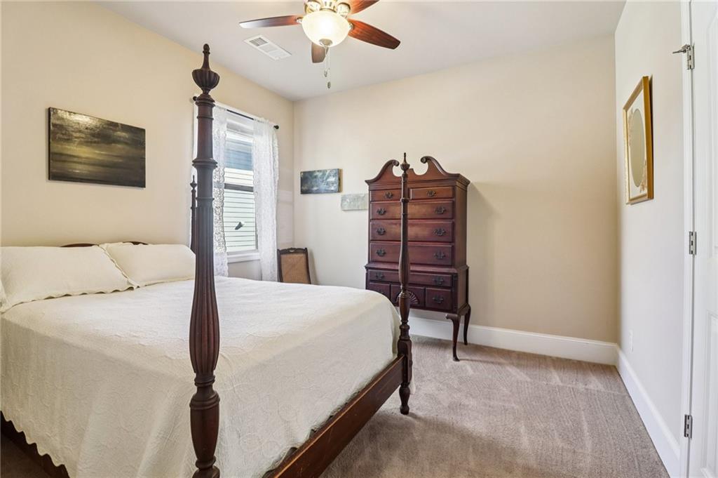 2007 Eagles Ridge Waleska, GA 30183 - Photo 15 of 45 a bedroom with a bed and a chandelier