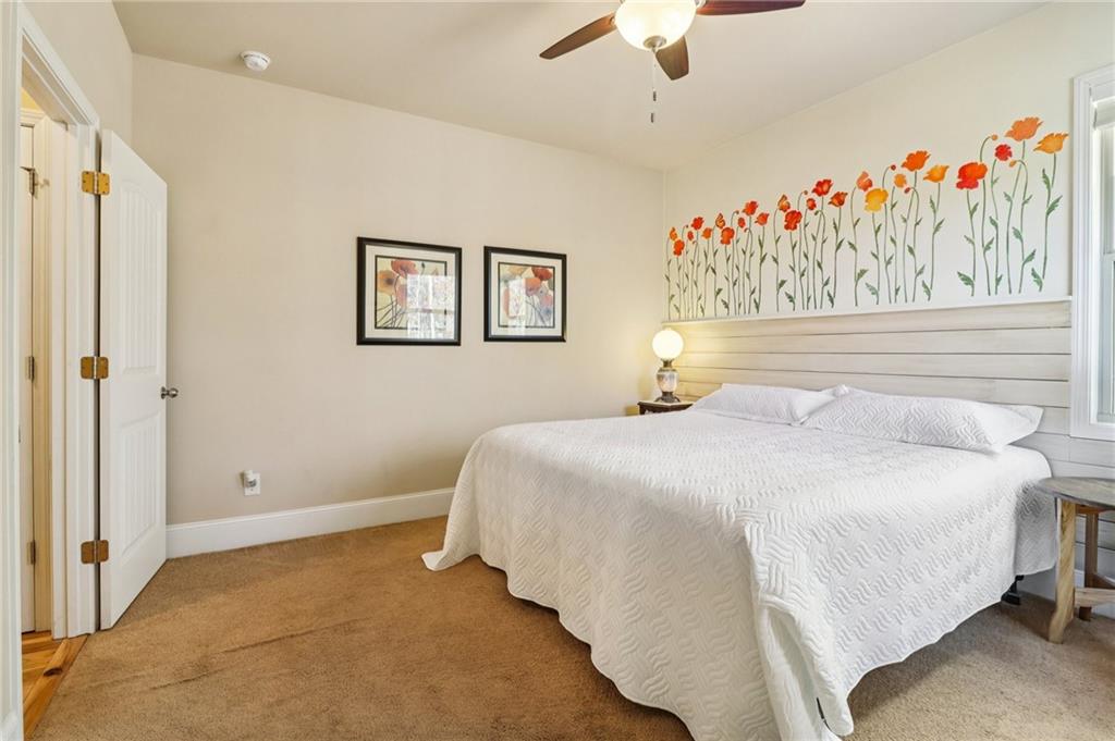 2007 Eagles Ridge Waleska, GA 30183 - Photo 17 of 45 a bedroom with a bed and a painting on the wall