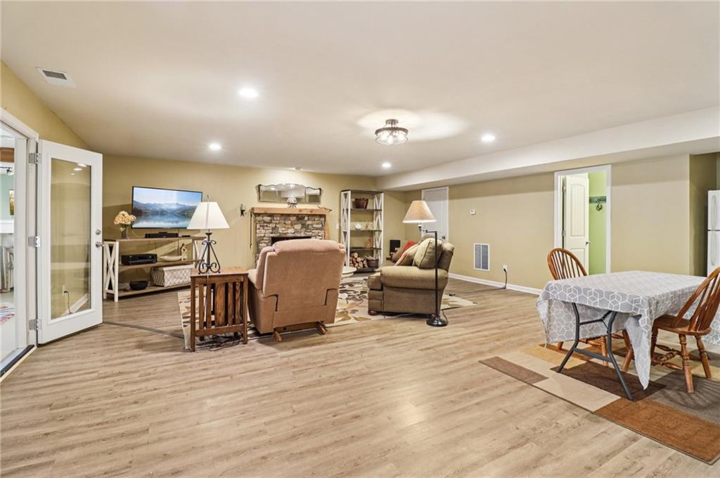 2007 Eagles Ridge Waleska, GA 30183 - Photo 22 of 45 a living room with furniture and a dining table with wooden floor