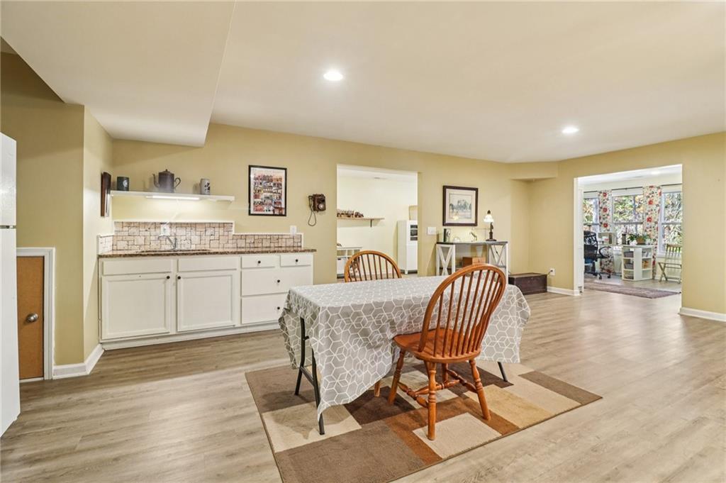2007 Eagles Ridge Waleska, GA 30183 - Photo 23 of 45 a view of a dining room with furniture and wooden floor