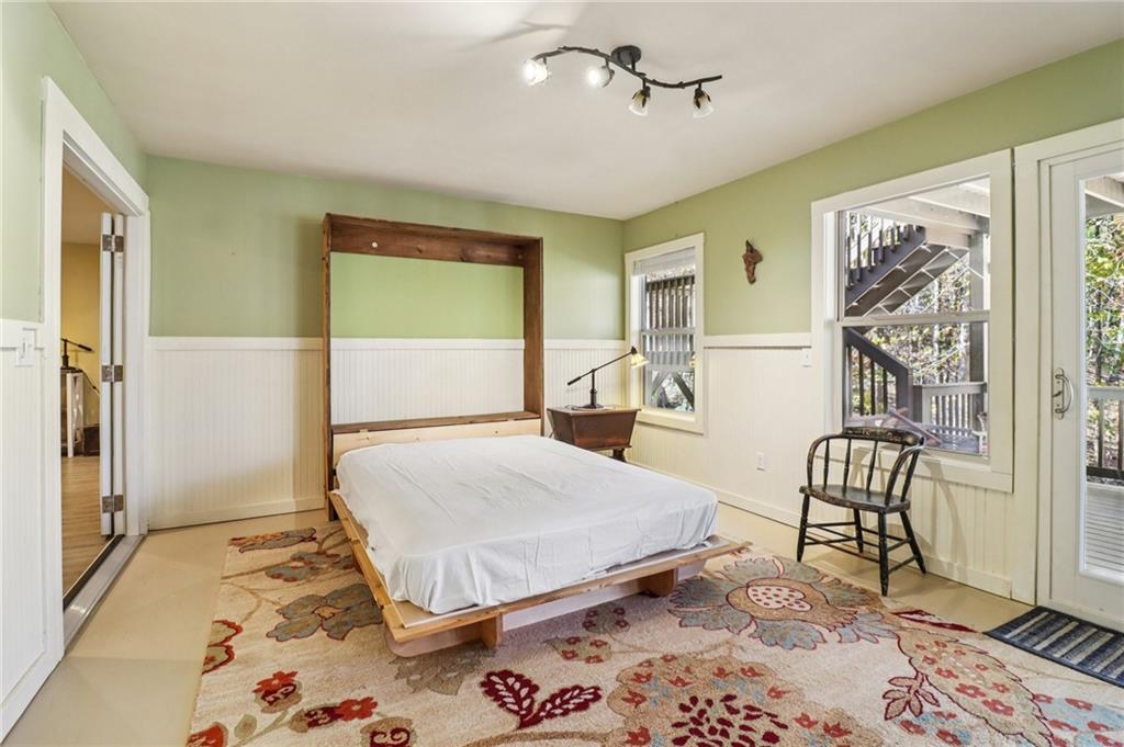 2007 Eagles Ridge Waleska, GA 30183 - Photo 26 of 45 a bedroom with a bed and wooden floor