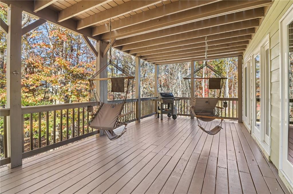 2007 Eagles Ridge Waleska, GA 30183 - Photo 29 of 45 a view of a balcony with chairs and wooden floor