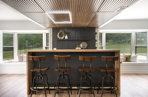 a dining room with furniture and wooden floor