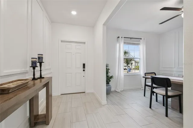 a kitchen with stainless steel appliances a microwave and white cabinets