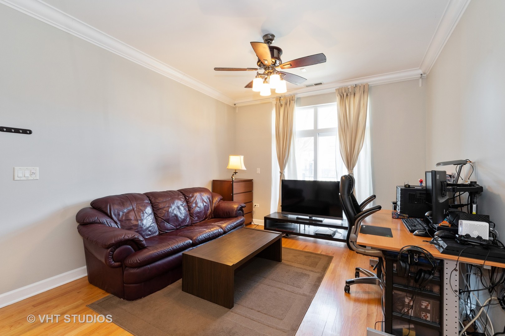 756 West 14th Street, Unit 102 Chicago, IL 60607 - Photo 2 of 10 a living room with furniture and a flat screen tv