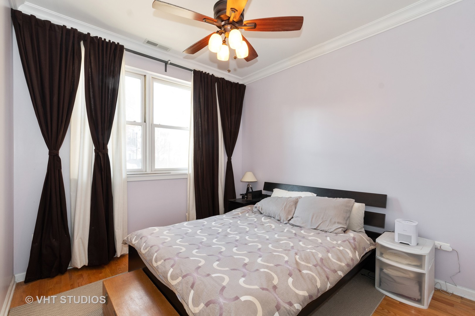 756 West 14th Street, Unit 102 Chicago, IL 60607 - Photo 6 of 10 a bedroom with a bed and a large window